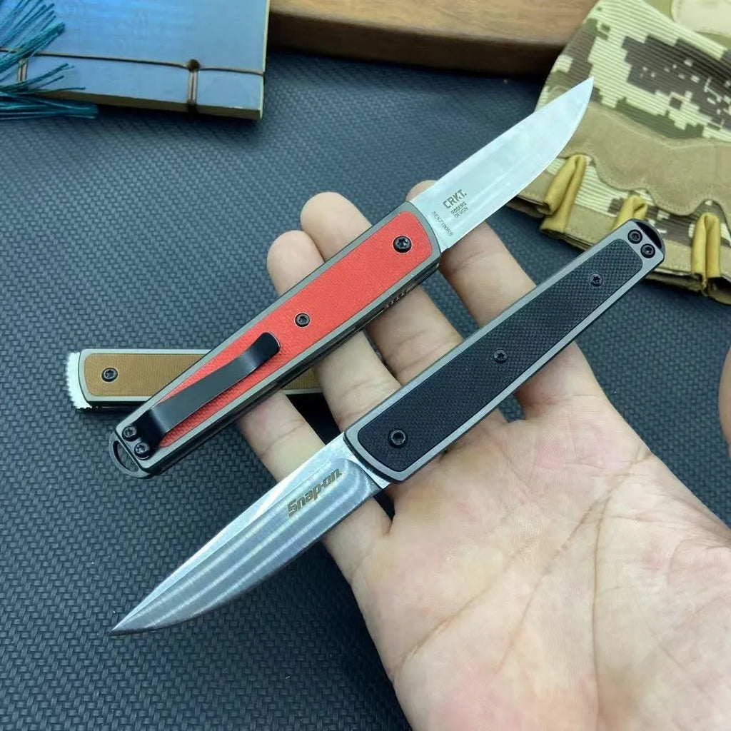 Folding fruit knife with stainless steel blade in black, coffee, or red colour options showing extended and closed positions