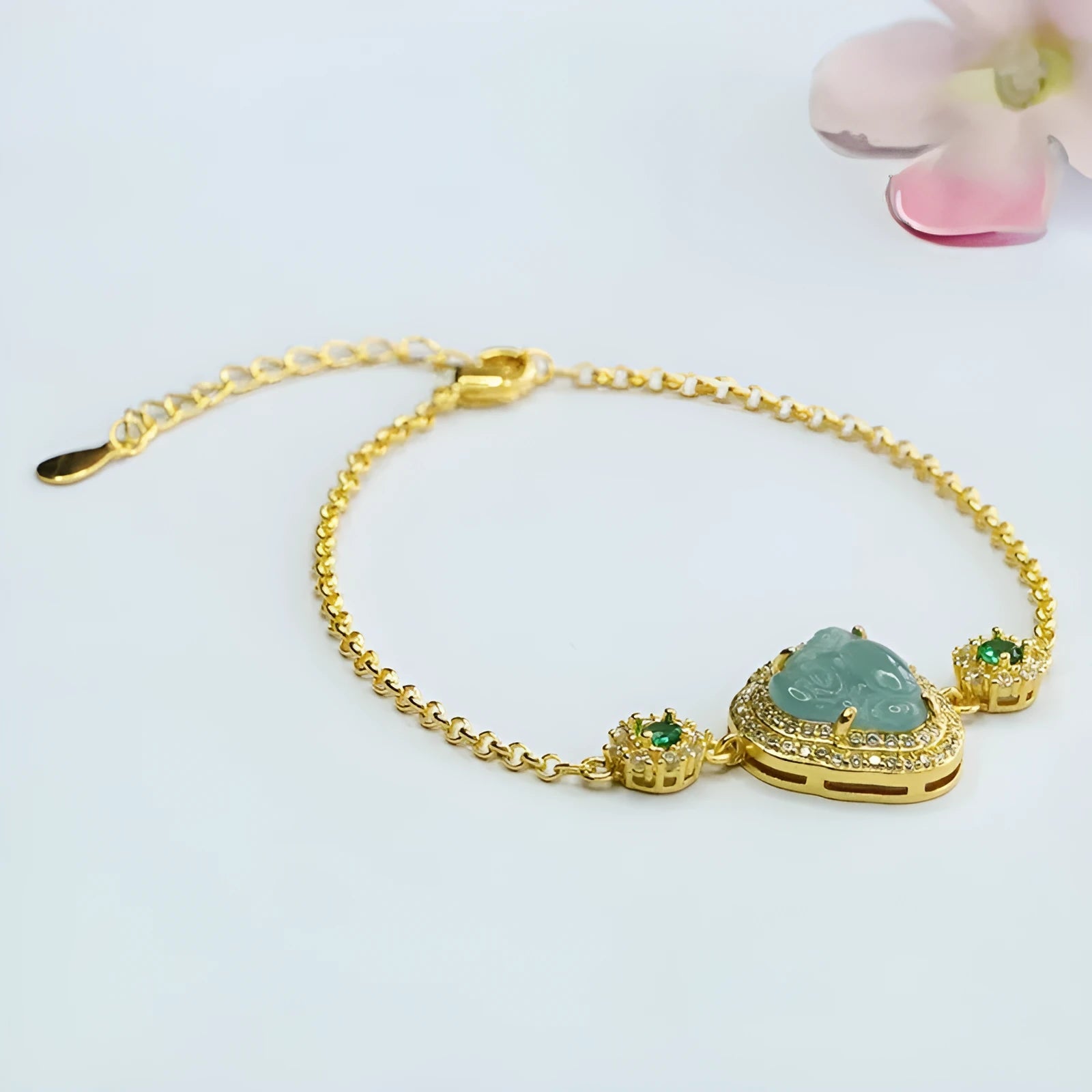 Blue jade bracelet with carved Maitreya Buddha, 10x13mm, inlaid design.
