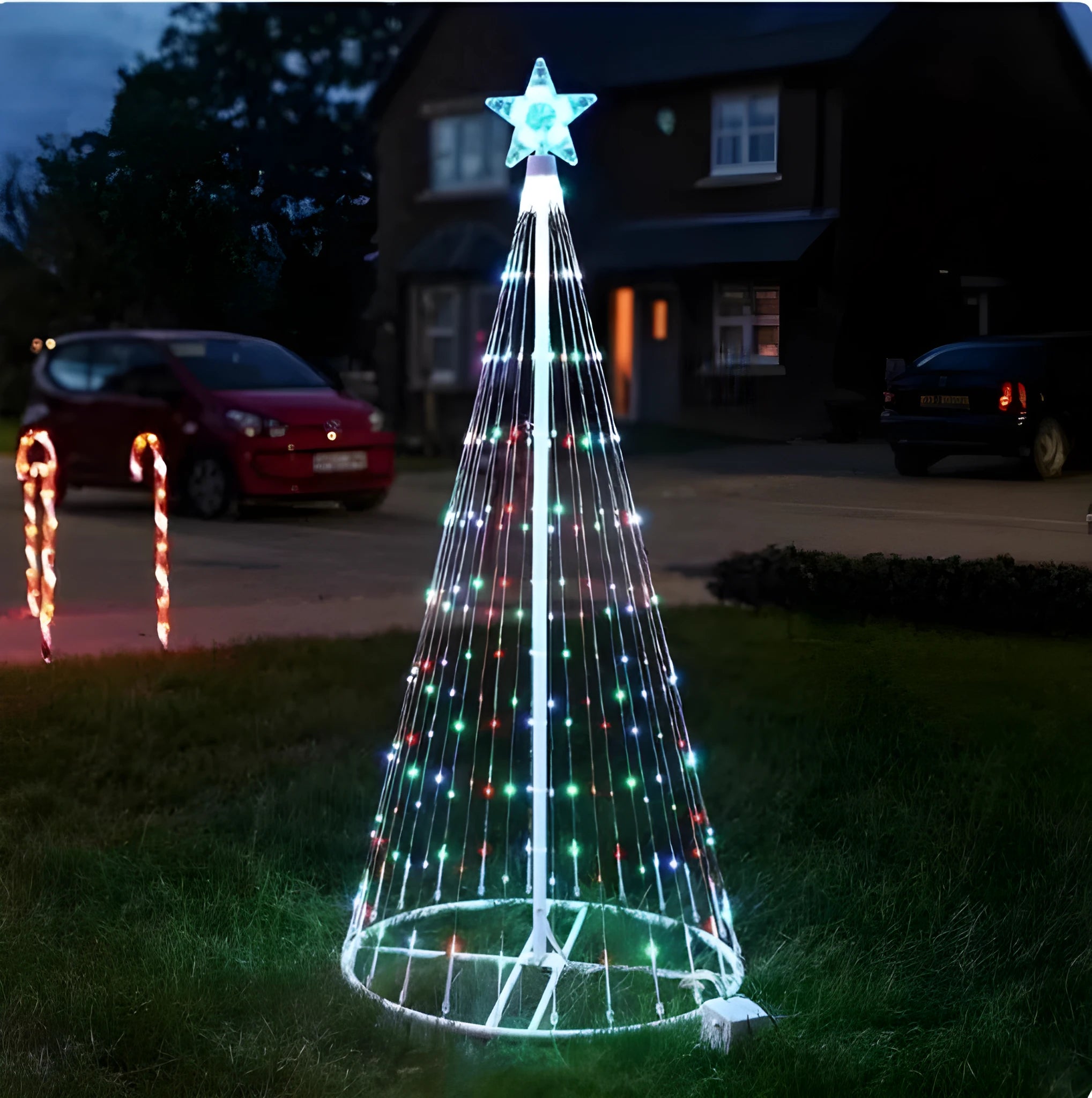 Multi-colour LED animated outdoor Christmas tree lights wrapped around a garden tree branch.