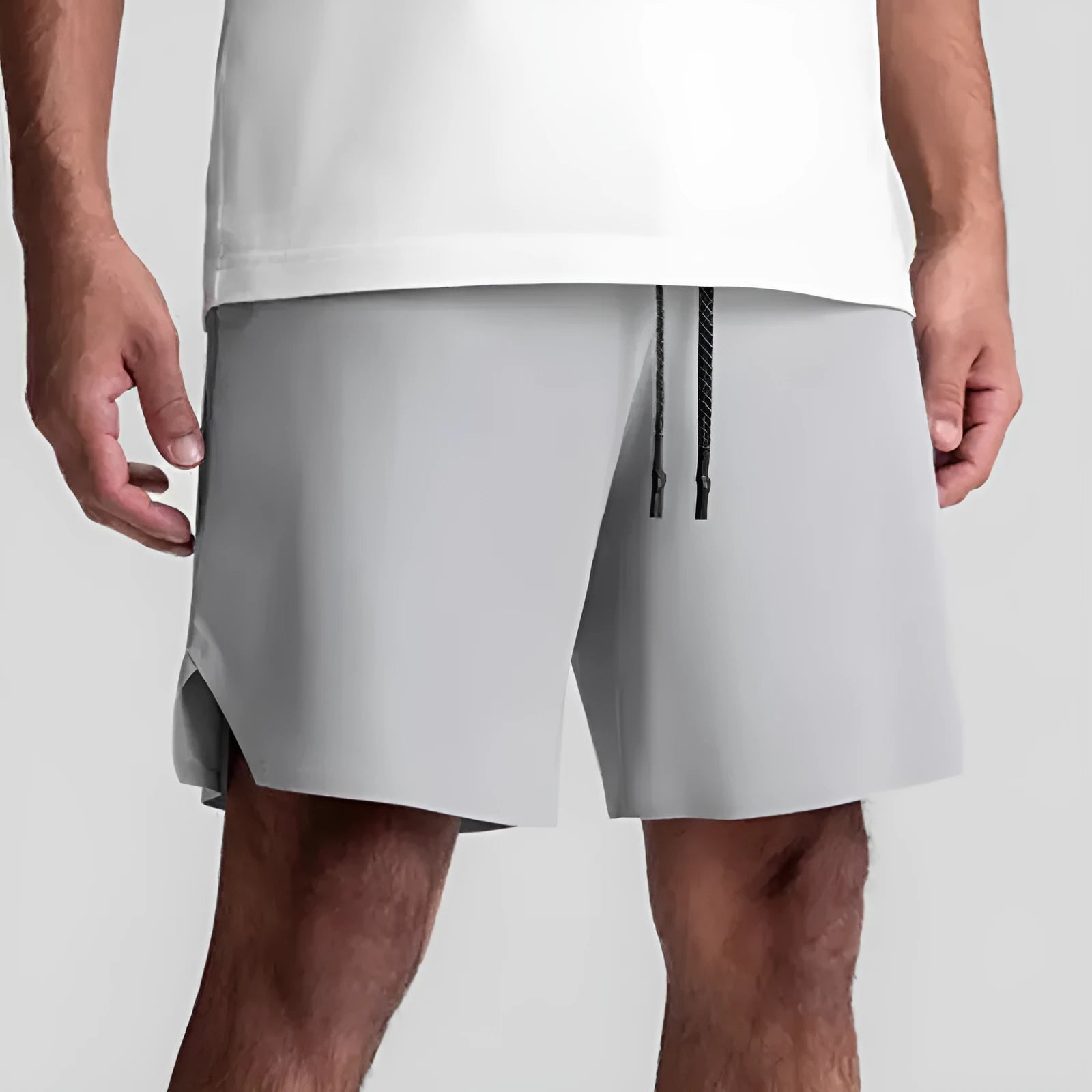 Men's grey seamless sports shorts with knee length and straight cut design for athletic activities