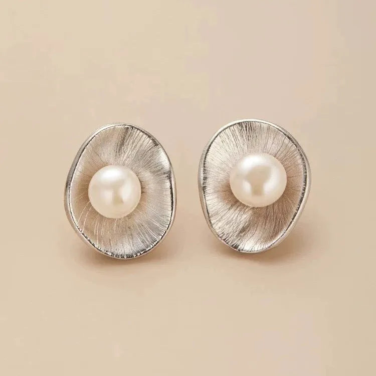 Sterling silver needle earrings with geometric design and pearl accents in gold electroplated finish