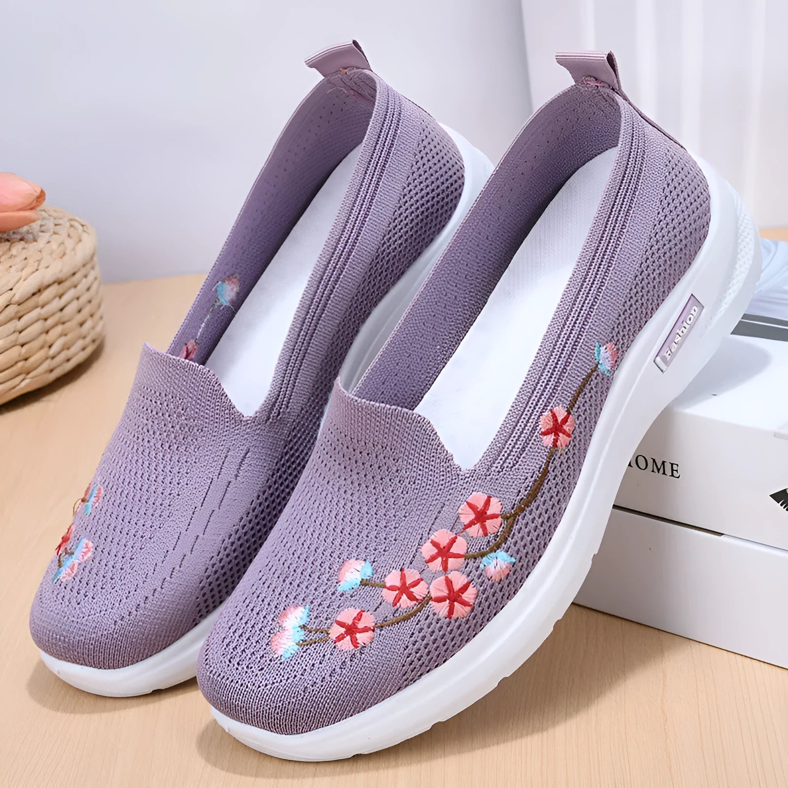 Women's wine red embroidered low heel pumps with round toe and anti-slip sole.