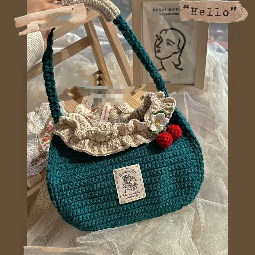 Wool crocheted bear shoulder bag with wooden handle showing crochet texture and random colour design