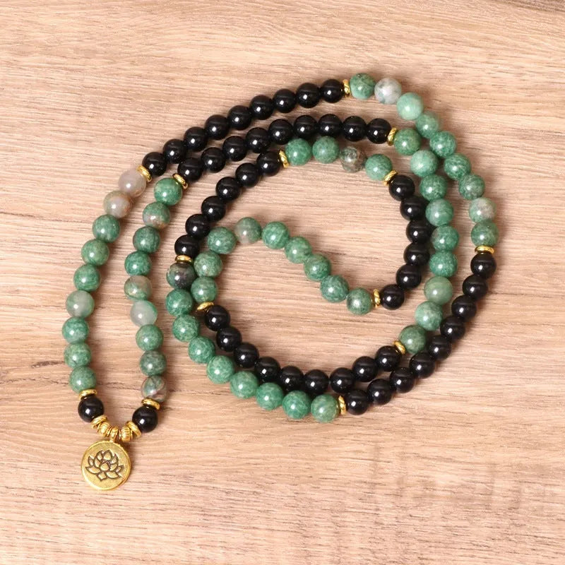 Green and black elastic beaded long bracelet with alloy construction