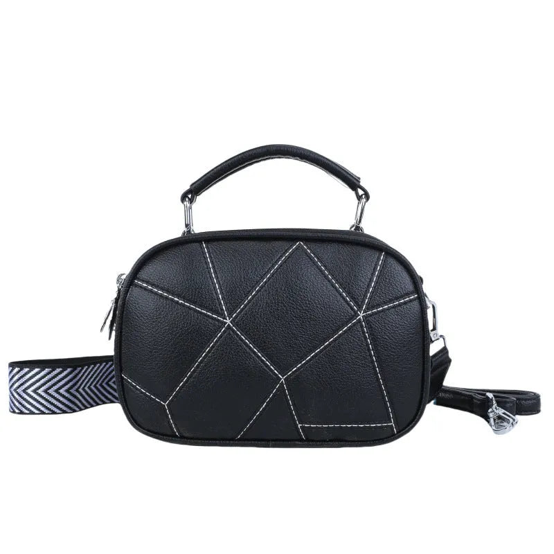 Three-layer retro patchwork small bag in round suitcase shape with stitching detail
