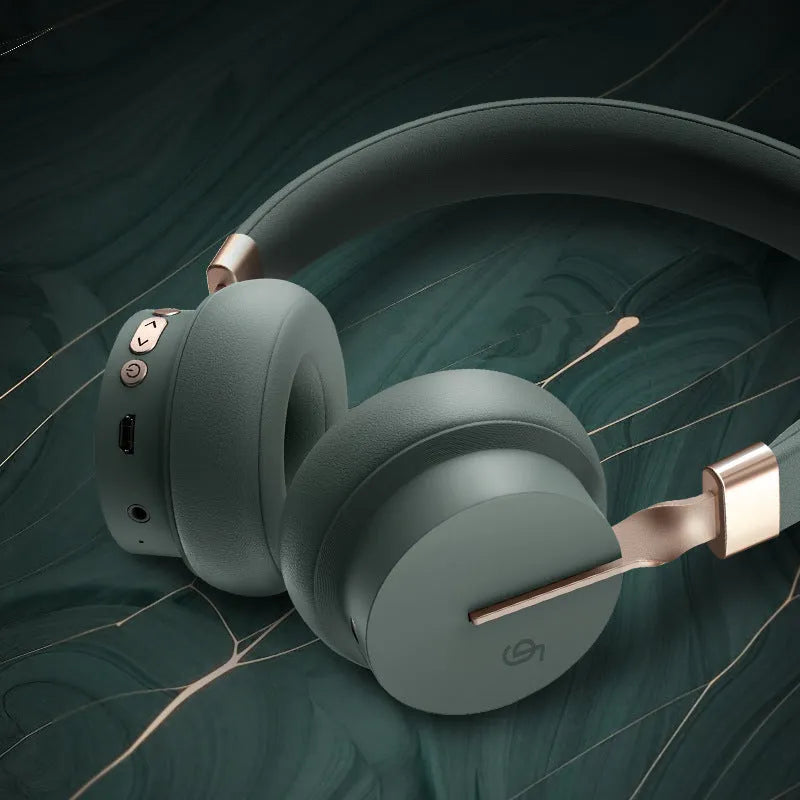 Solid colour headworn Bluetooth headset in one of five colours: green, black, blue, red, or white.