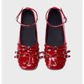 Women's black genuine leather retro buckle pumps with flat heel, square toe, and metal rivet decoration.
