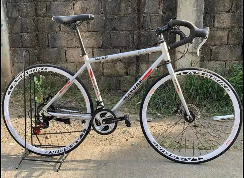 Aluminium alloy road bike with flat handlebar in matte blue finish 48cm frame size