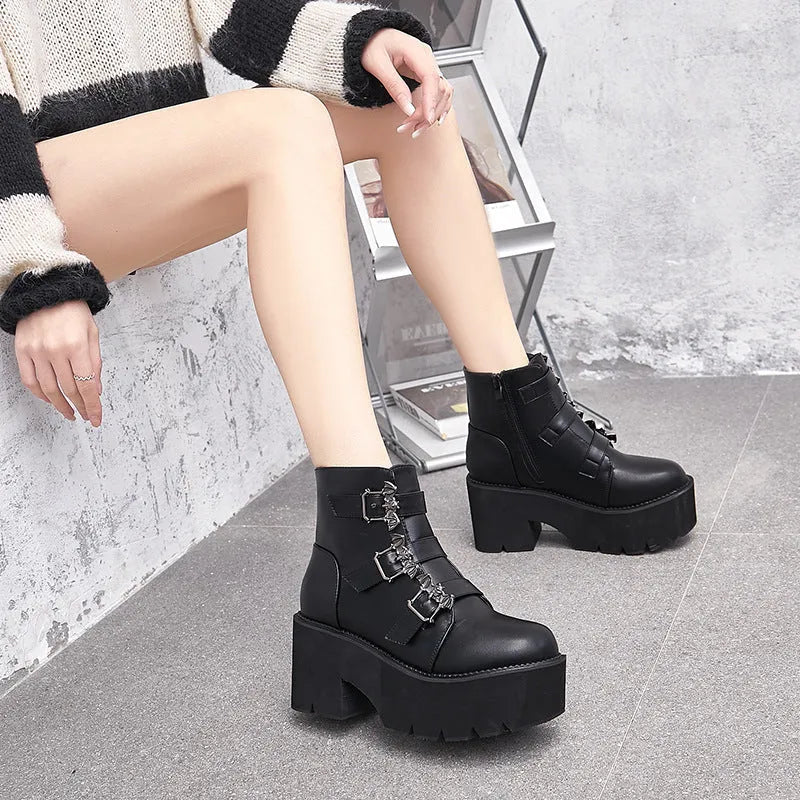 Black women's punk gothic Martin boots with bat buckle and side zip.