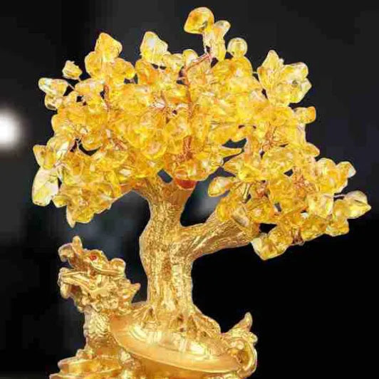 Citrine-coloured resin ornament of a turtle money tree in Chinese Feng Shui style.