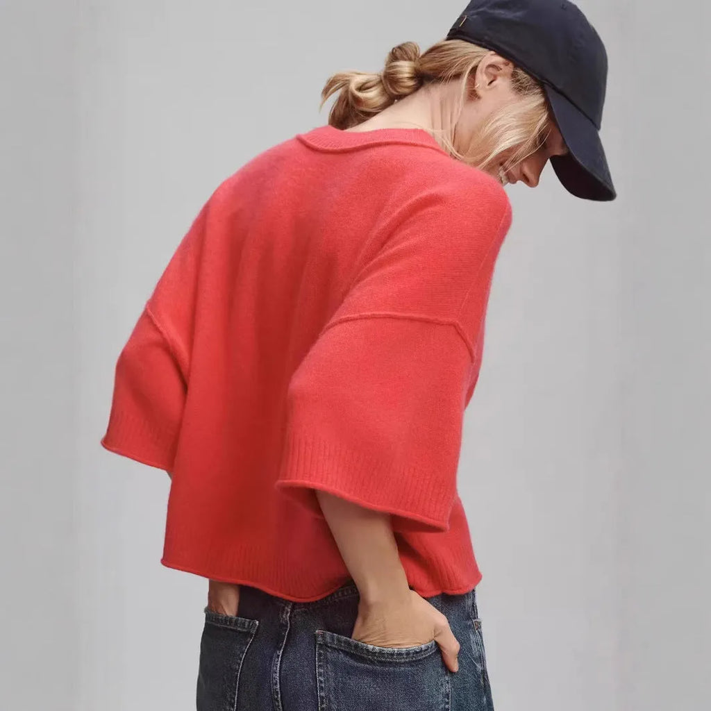 Red cropped women's t-shirt with regular sleeves and exposed navel styling on mannequin