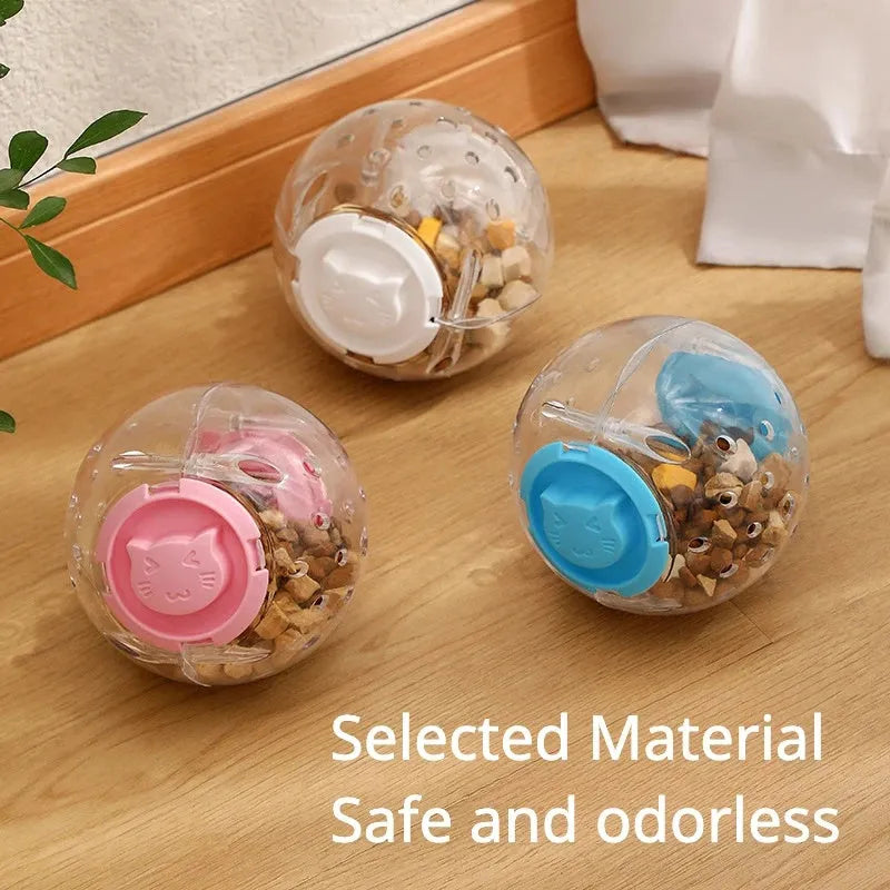 Blue ABS plastic cat slow feeder ball toy with visible treat holes on a white background.