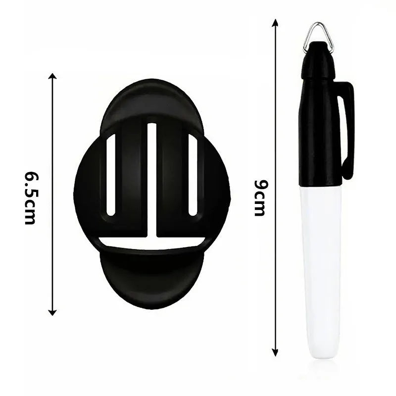 Golf ball alignment tool with four scriber pins and a drawing pen on a green.