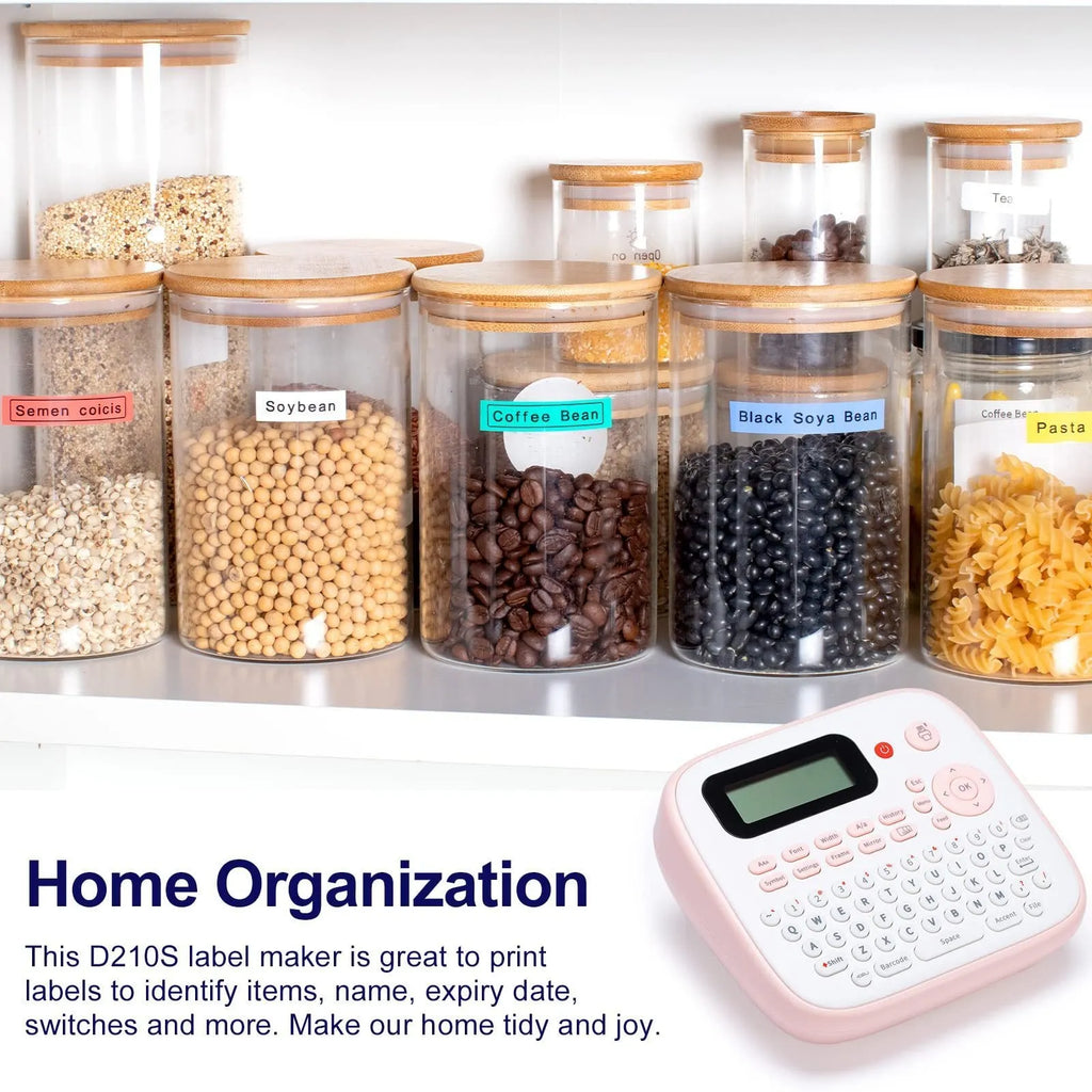Mini portable ink-free Bluetooth label printer in pink with label tape roll, UK AC adapter, and user manual on a desk