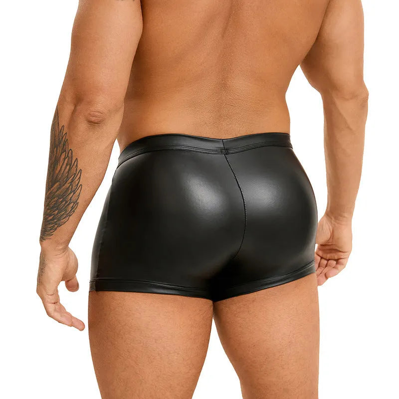 Men's black PU leather boxer shorts with U pouch design laid flat, showing sleek material and construction.