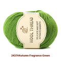 Roll of wool knitting yarn in various colours for hand knitting baby garments with a 10 needle.