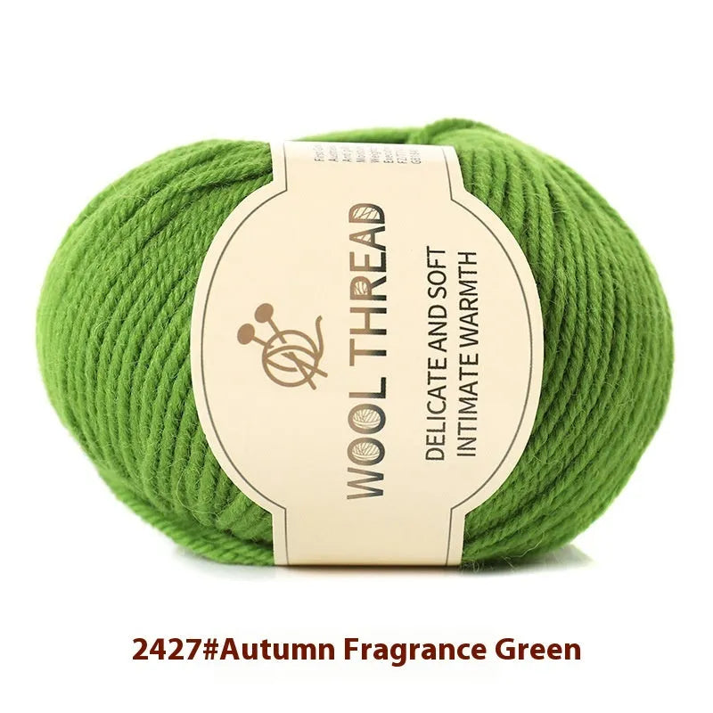 Roll of wool knitting yarn in various colours for hand knitting baby garments with a 10 needle.