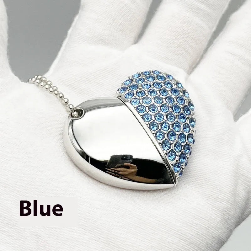 Blue heart-shaped USB flash drive with a textured brick-inlaid pattern on its metal shell.