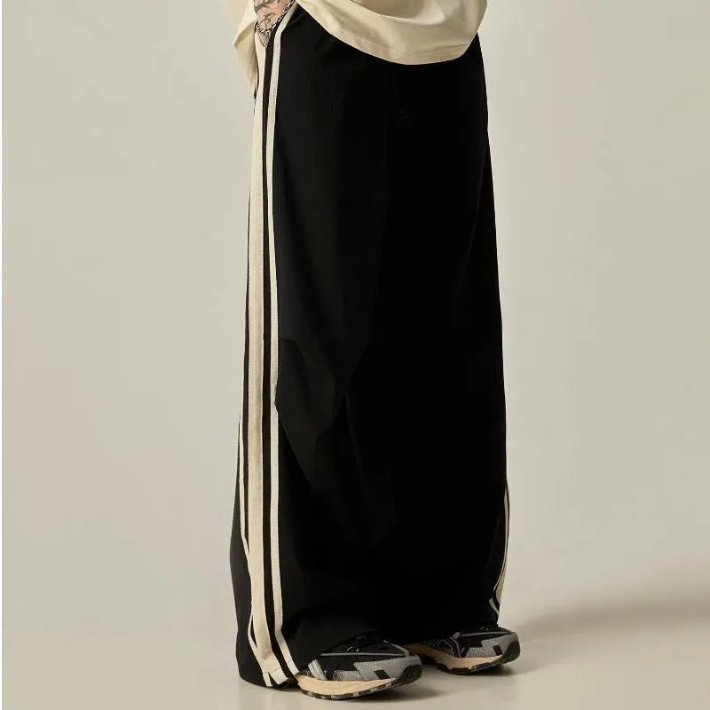 Black wide-leg climbing trousers for men with high waist and straight-leg design.