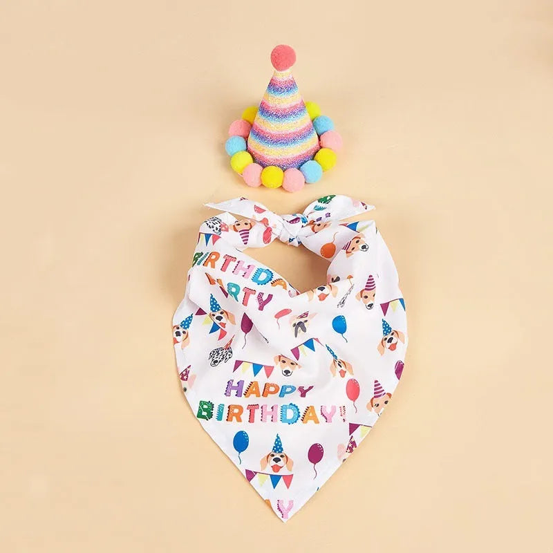 Printed polyester dog birthday hat and drool towel set in cartoon style with blue and pink colour options.