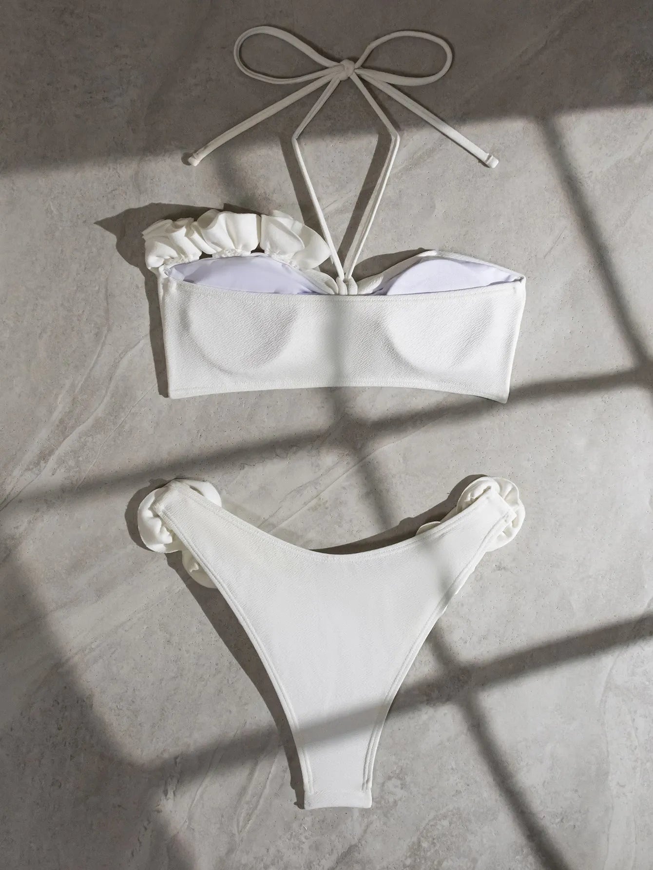 White halter neck lace-up swimsuit with three-dimensional floral pattern and split briefs style