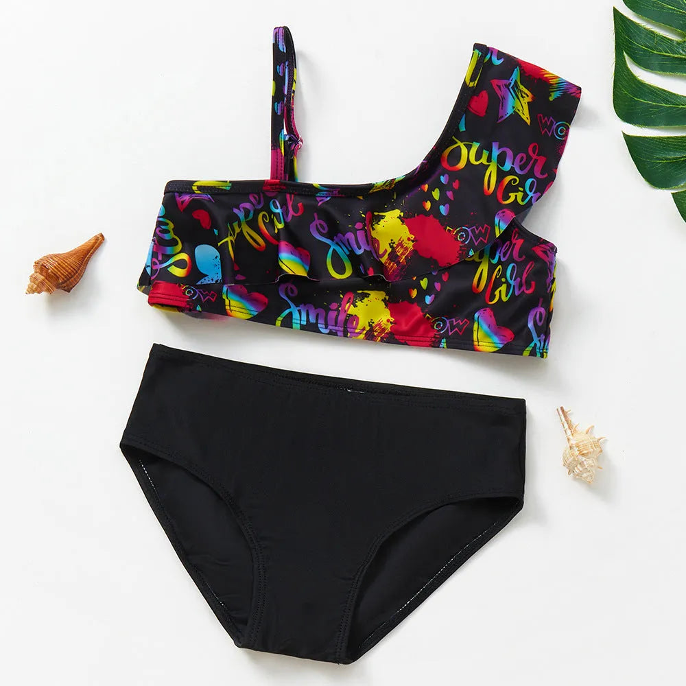 Girls' two-piece swimsuit with oblique shoulder strap, split design, polyester fabric, in butterfly, graffiti, or lemon yellow.