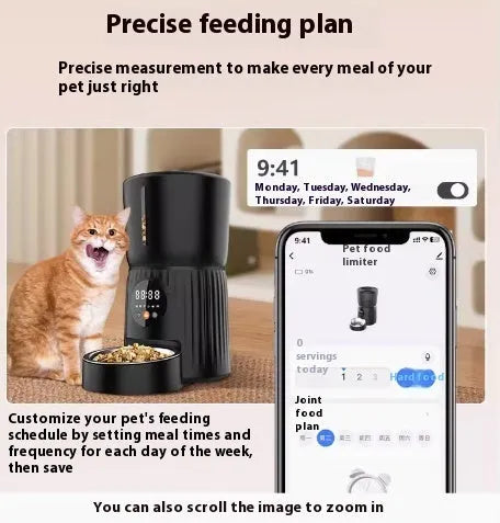 Black automatic pet feeder with digital display and food bowl on a kitchen counter.