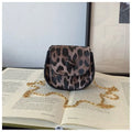 Leopard print mini crossbody saddle bag in PU, horizontal square shape with sandwich pocket, black and reddish brown