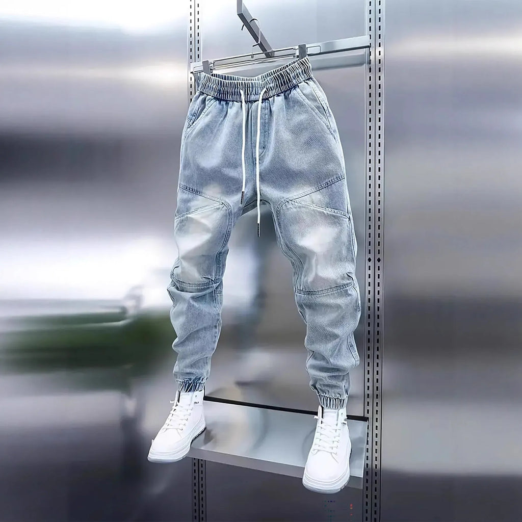 Men's light blue denim pencil pants with elastic ankle bands and drawstring mid waist