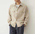Men's light sand rice coloured shirt with a lapel collar and long sleeves.