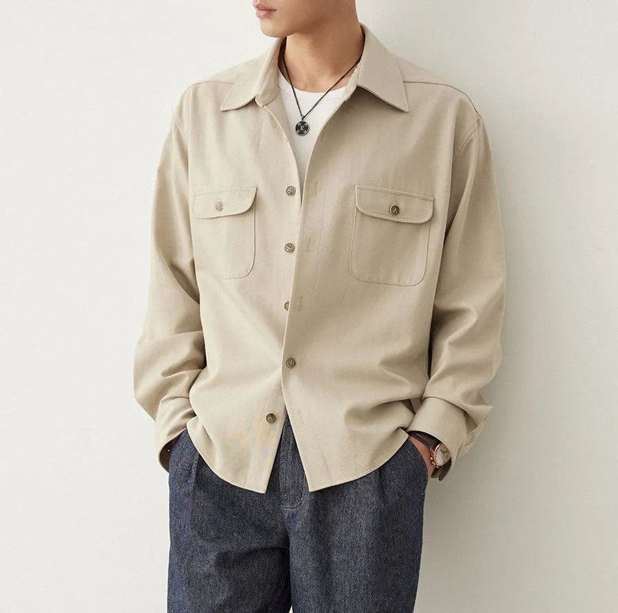 Men's light sand rice coloured shirt with a lapel collar and long sleeves.