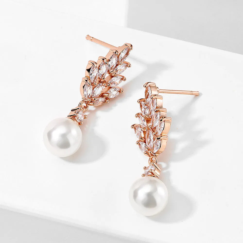 Geometric flower earrings with micro inlaid zircon in gold, rose gold, and white gold plated finishes.