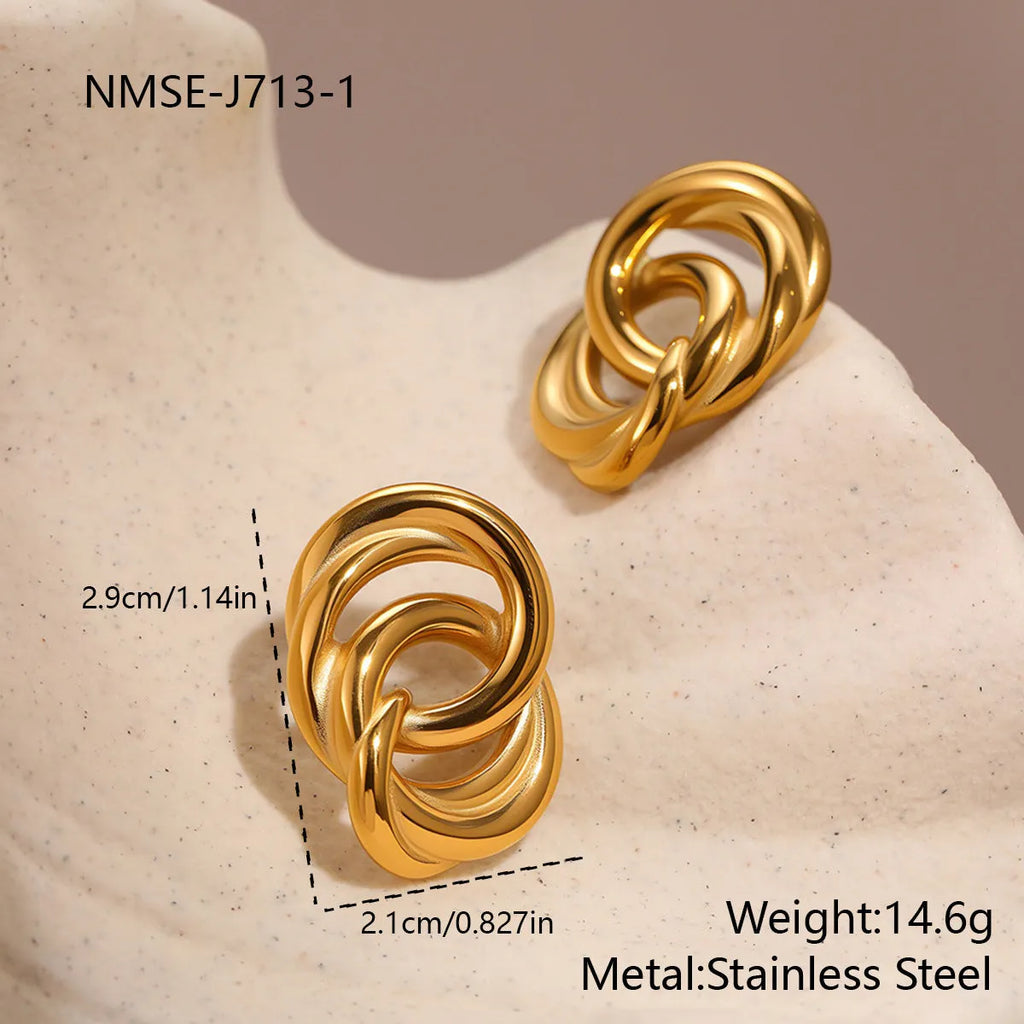 18K gold electroplated stainless steel geometric circle stud earrings on display