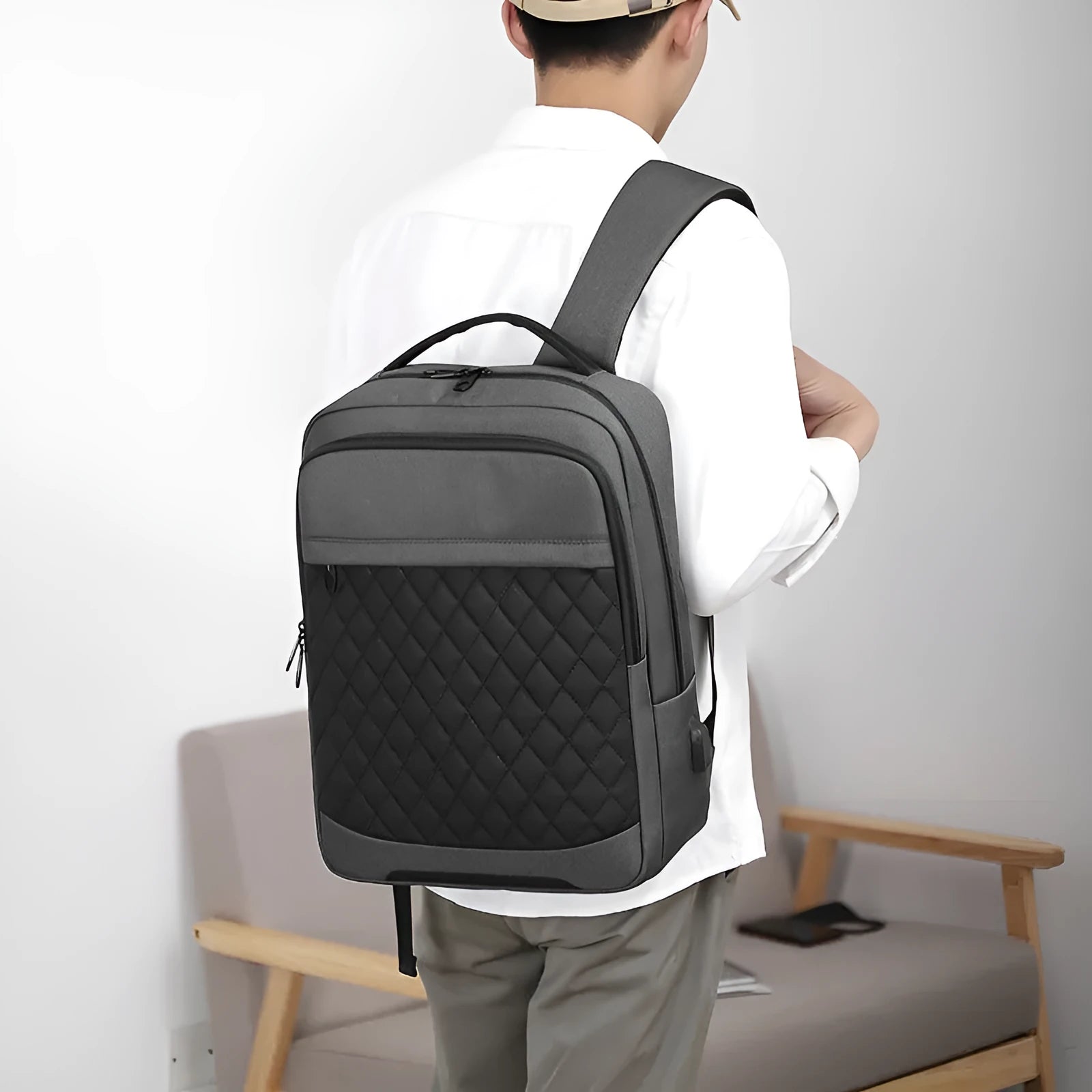 Men's solid colour Oxford cloth travel backpack with curved shoulder straps and diamond mesh detail