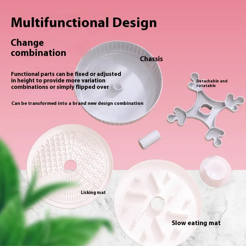 Grey pet bowl with a rotating windmill-pattern silicone licking mat for slow feeding on a kitchen floor.