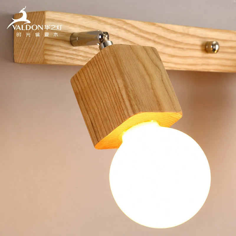 Single head mirror cabinet wall lamp with a 24cm diameter frame.