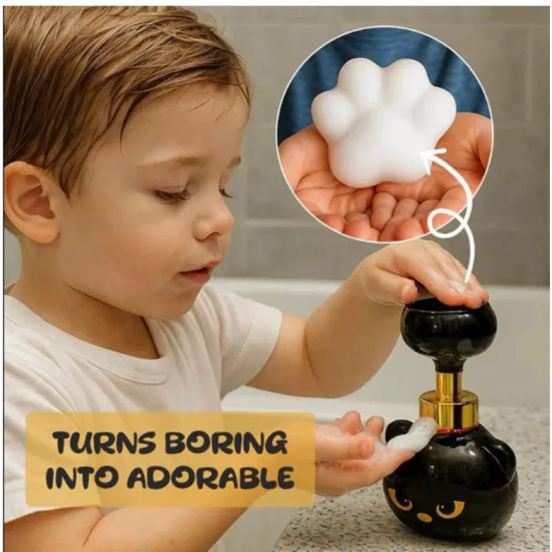 Black cartoon cat-shaped plastic foam soap dispenser pump, 10cm wide by 18cm tall.