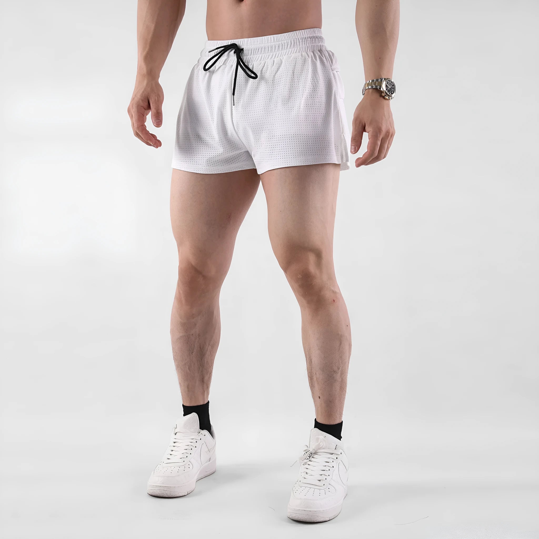 Man wearing black quick-drying nylon summer shorts in a sports leisure style.
