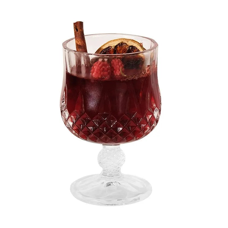 Scented candle in a glass wine goblet with translucent jelly crystal wax and French mulled wine label.