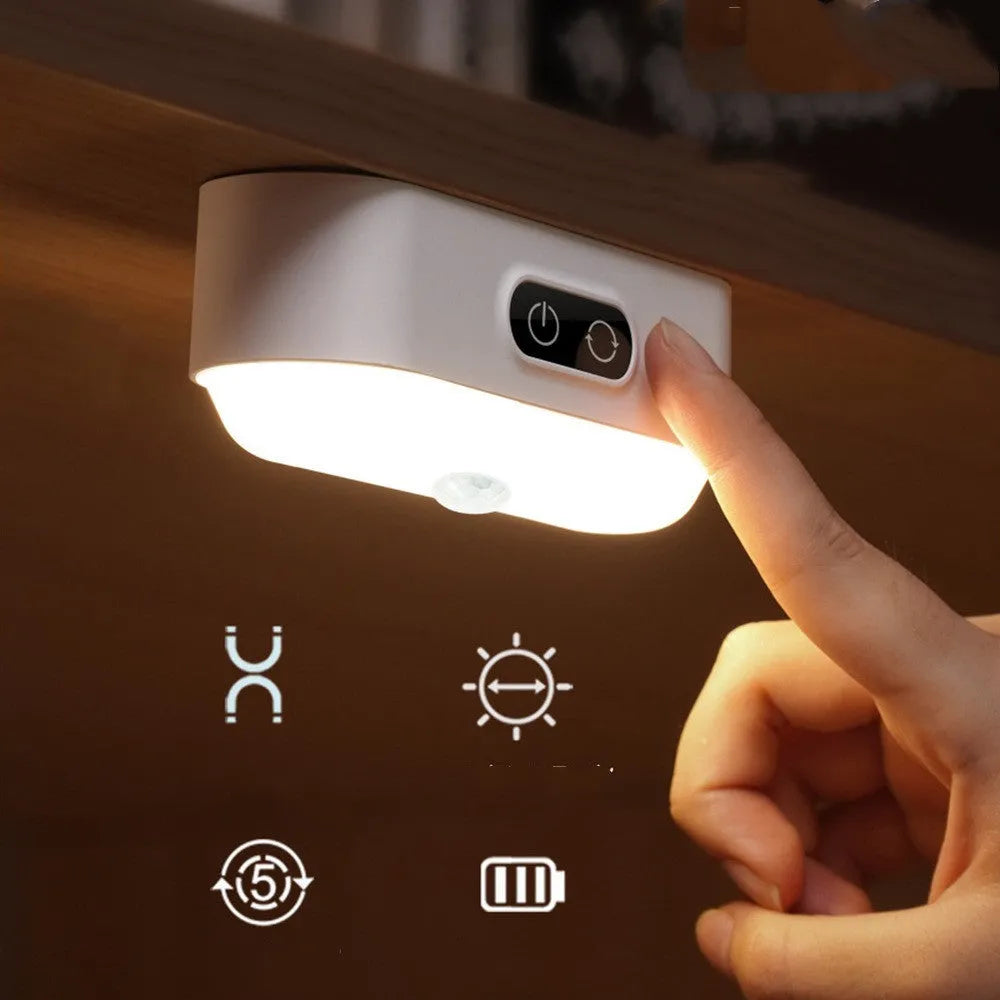 White magnetic USB rechargeable LED night light with touch controls mounted on a metal surface.