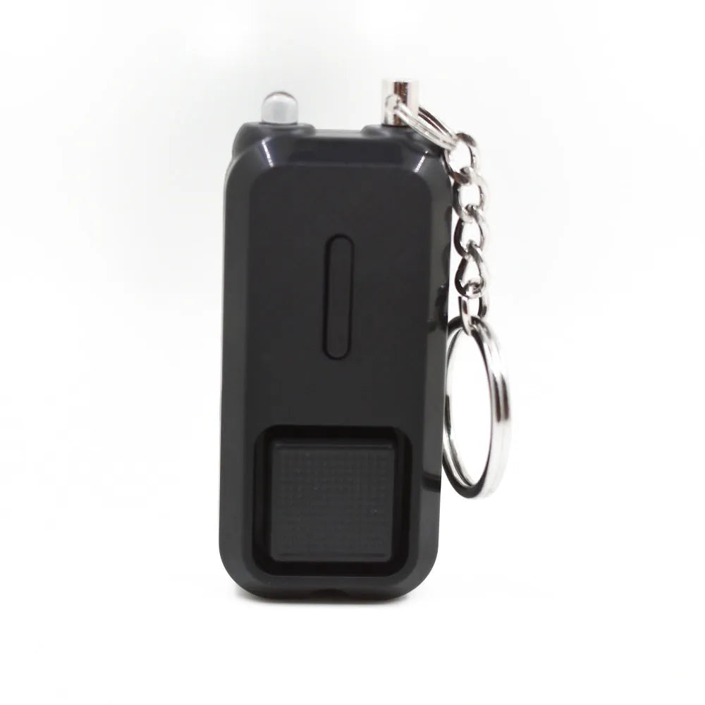 Pink personal safety alarm keychain with button, shown next to its white product box.