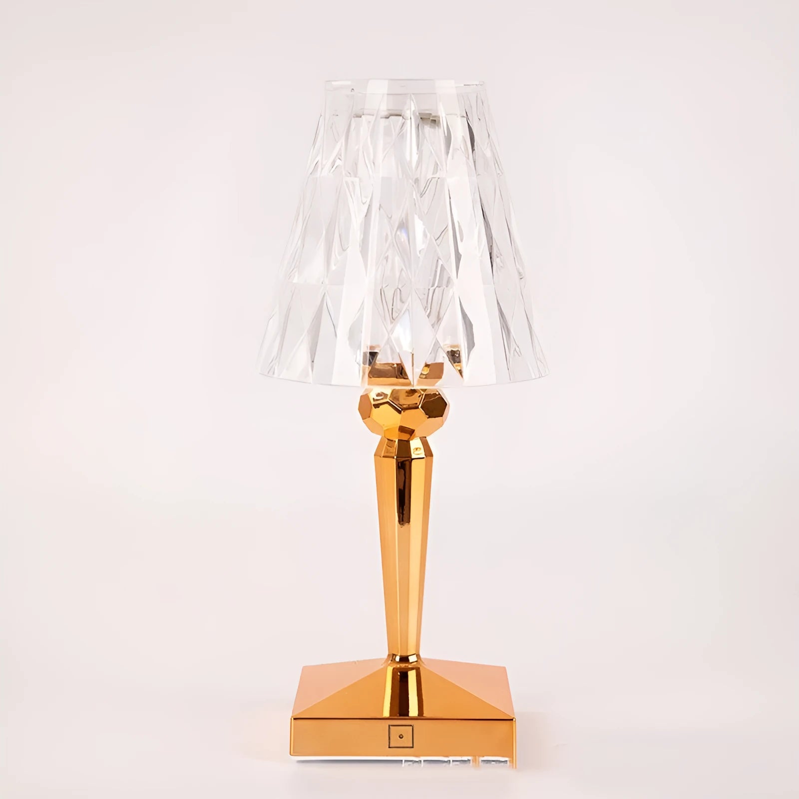 Rose gold portable touch night light on a surface showing its dimming touch controls.