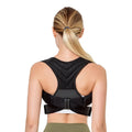 Black adjustable anti-humpback posture correction belt worn on a person's torso, showing shoulder straps and chest support.