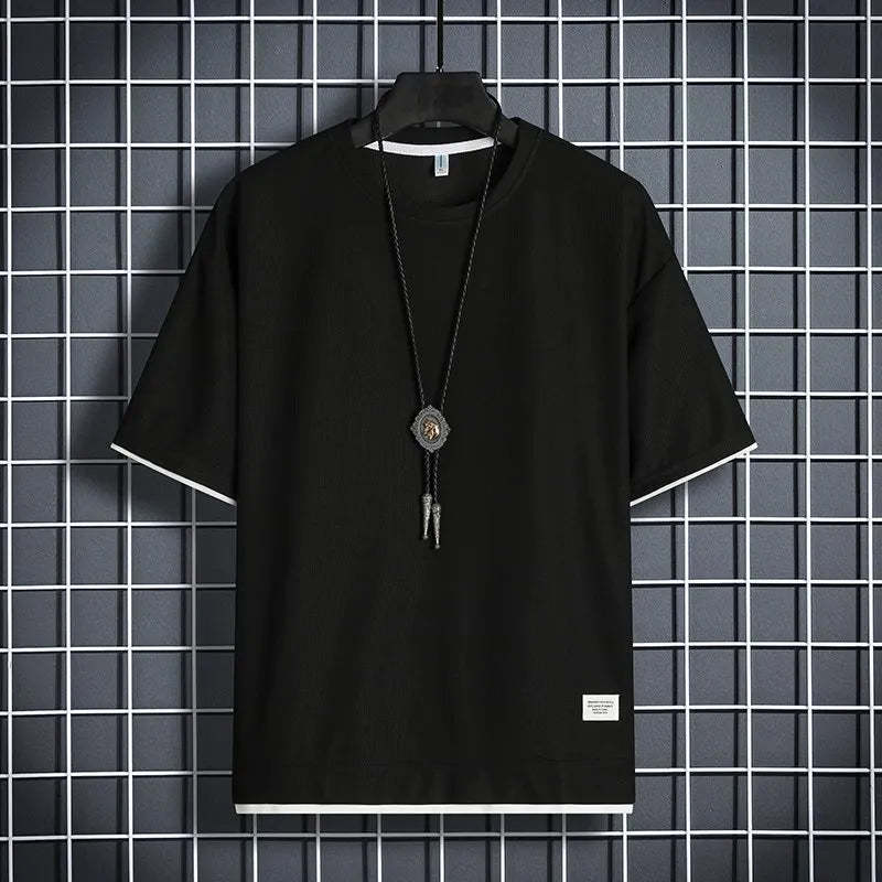 Half sleeve loose pullover top in polyester, available in seven colours and sizes M to 5XL