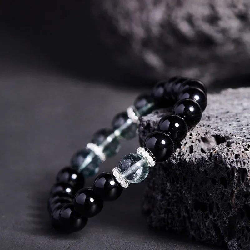Chinese style black geometric bead bracelet with sterling silver components on wrist