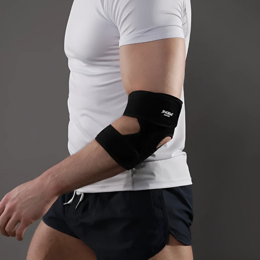 Black adjustable sports elbow guard shown on arm during athletic activity