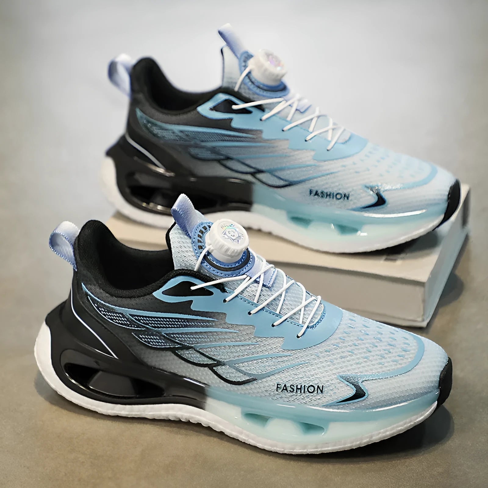 Men's low-top rotating button sneaker in black, light blue, or white and blue, with mesh or leather upper.