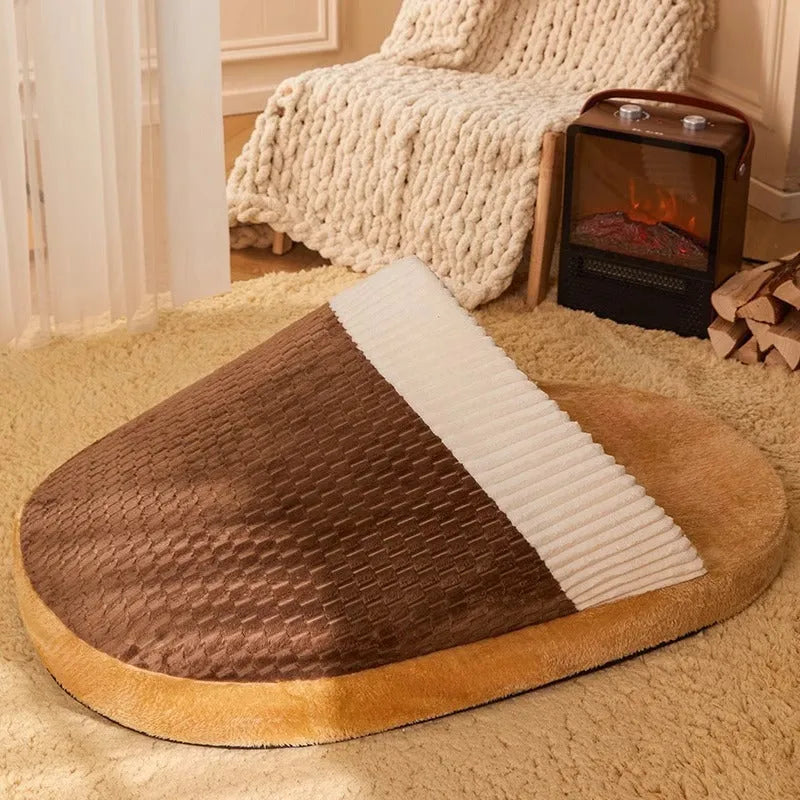 Blue dog nest sleeping bag with removable cover, shown in a medium size.