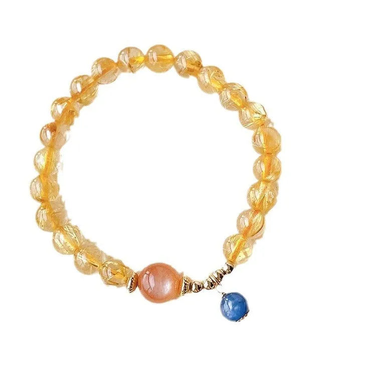 Handmade natural gold rutilated quartz and sunstone crystal bracelet with round diamond-shaped elements