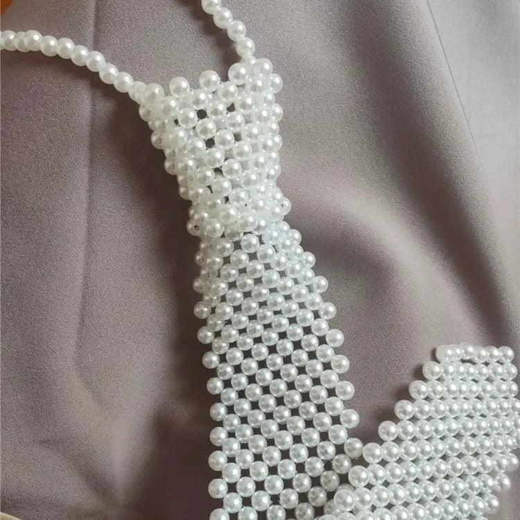 Pearl tie body chain with hollow out design and imitation pearl details in retro style